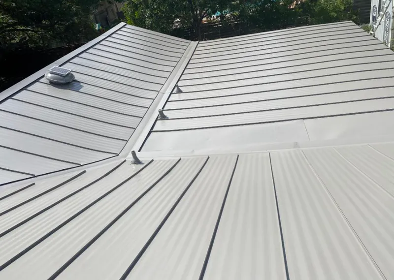 Solar attic fan installed on a metal roof for Roof Ventilation in White Bear Lake